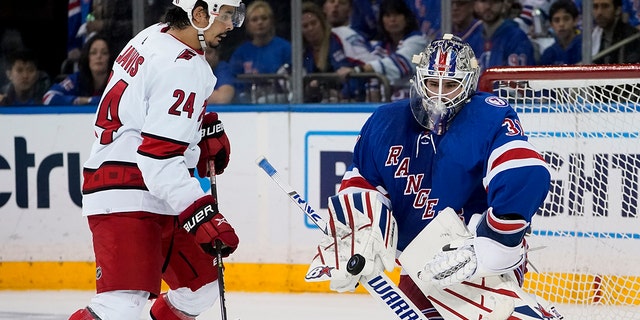 New York Rangers goaltender Igor Shesterkin (31) makes a save against Carolina Hurricanes center Seth Jarvis (24) during the second period of Game 6 of an NHL hockey Stanley Cup second-round playoff series, Saturday, May 28, 2022, in New York. (AP Photo/John Minchillo)