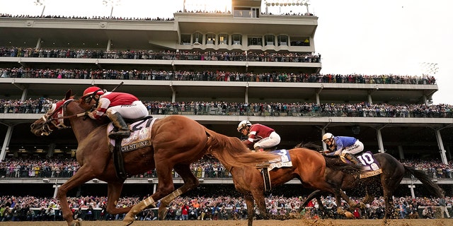 Rich Strike leads Epicenter and Zandon in the 148th running of the Kentucky Derby at Churchill Downs, May 7, 2022, in Louisville, Kentucky.