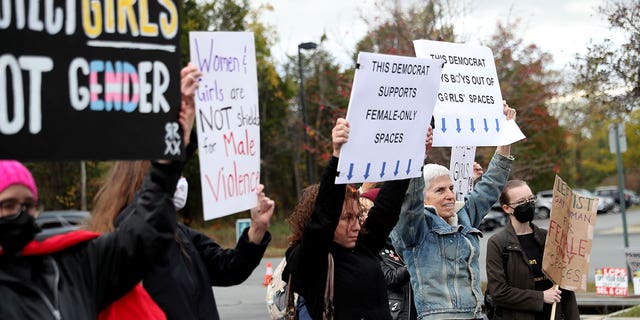 People gather to protest different issues including the board’s handling of a sexual assault that happened in a school bathroom in May, vaccine mandates and critical race theory during a Loudoun County School Board meeting in Ashburn, Virginia, U.S., October 26, 2021. Picture taken October 26, 2021.