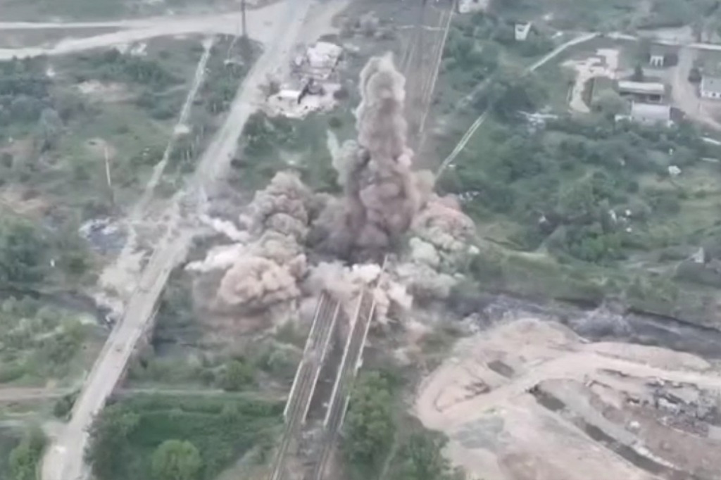 An explosion in Sievierodonetsk after Ukrainian forces blew up a bridge while defending the city from Russia.