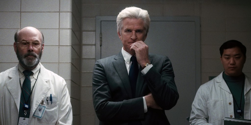 Matthew Modine in a dark suit as the character Dr. Brenner in "Stranger Things."