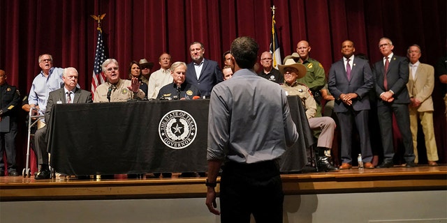 Texas Democratic gubernatorial candidate Beto O'Rourke disrupts a press conference held by Gov. Greg Abbott the day after a gunman killed 19 children and two teachers at Robb Elementary school in Uvalde, Texas, May 25, 2022. 