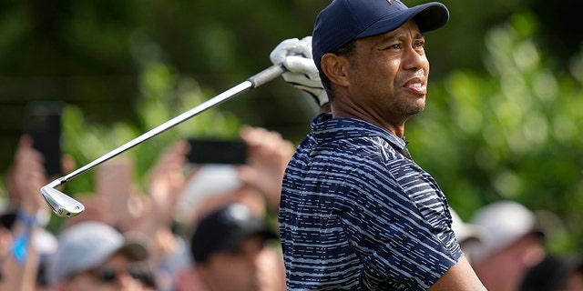 Tiger Woods watches his shot on the 15th hole during the first round of the PGA Championship golf tournament, Thursday, May 19, 2022, in Tulsa, Okla. 