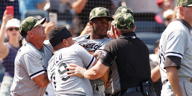 Jose Abreu #79 holds back Tim Anderson #7 of the Chicago White Sox after a benches-clearing dispute between Yasmani Grandal #24 of the Chicago White Sox (not pictured) and Josh Donaldson #28 of the New York Yankees (not pictured) during the fifth inning at Yankee Stadium on May 21, 2022 in the Bronx borough of New York City.