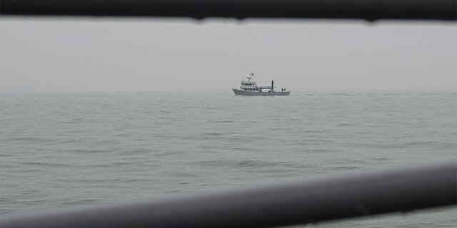 A Ukrainian serviceman mans a heavy machine gun on a military navy ship patrolling the Sea of Azov, waters near Mariupol, Donetsk region, in eastern Ukraine, Wednesday, Feb. 2, 2022. 