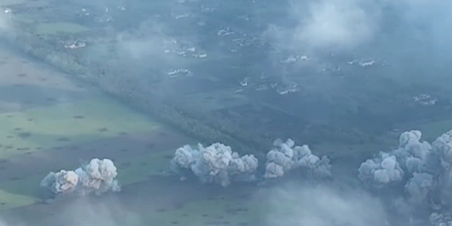 Smoke is seen rising into the sky following explosions caused by the Russian military in Novomykhailivka, Ukraine.