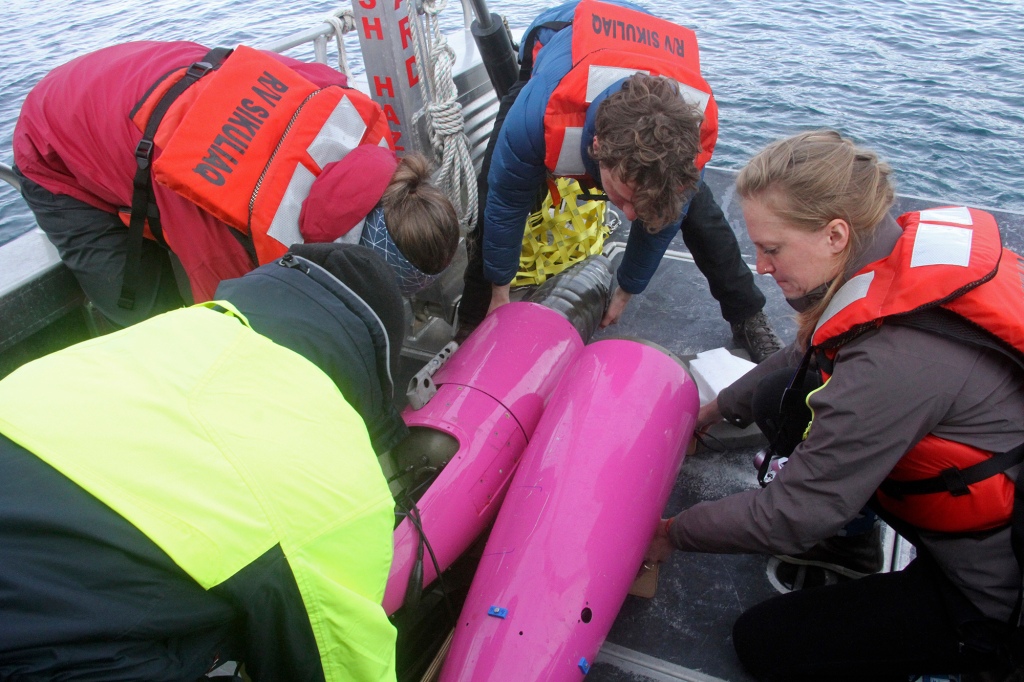 This May 4, 2022, photo shows an underwater glider being pulled apart on the University of Alaska Fairbanks research vessel Nanuq in the Gulf of Alaska to allow a sensor inside to be swapped out.