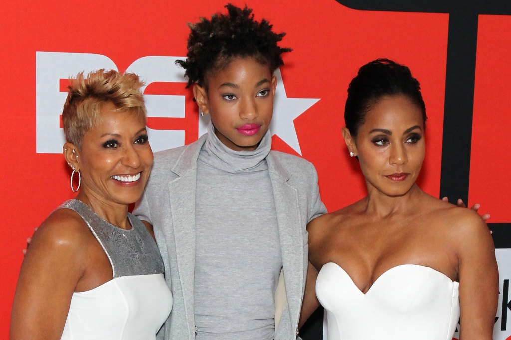 "Very rarely will you see Jada and I even touch, hug," said Norris, seen here with granddaughter Willow Smith and Jada. 