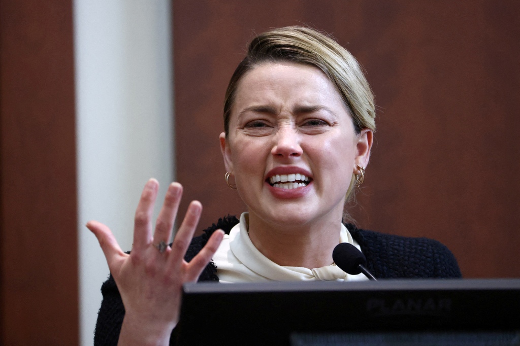 Actor Amber Heard reacts on the stand in the courtroom at Fairfax County Circuit Court during a defamation case against her by ex-husband, actor Johnny Depp, in Fairfax, Virginia, U.S., May 5, 2022.