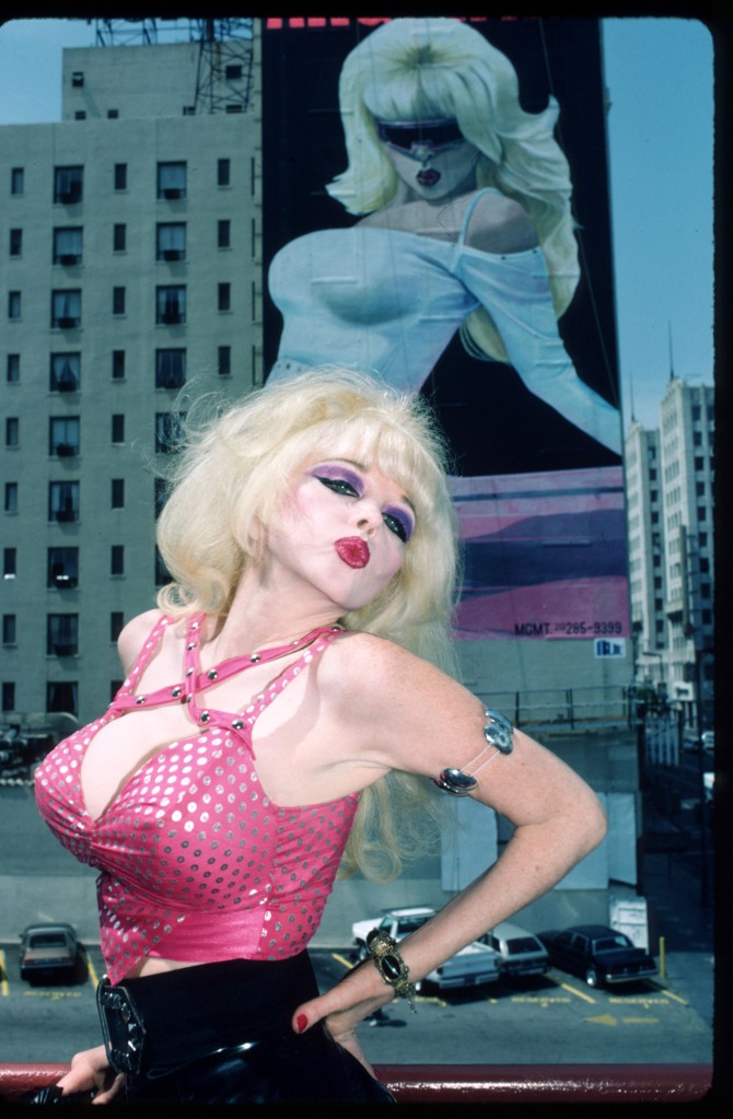 377824 01: Singer Angelyne poses in front of her billboard July 1987 in Los Angeles, CA. Angelyne will release her new album"Beware of My Boyfriend" this month and is famous for her posters. (Photo by John Barr/Liaison)