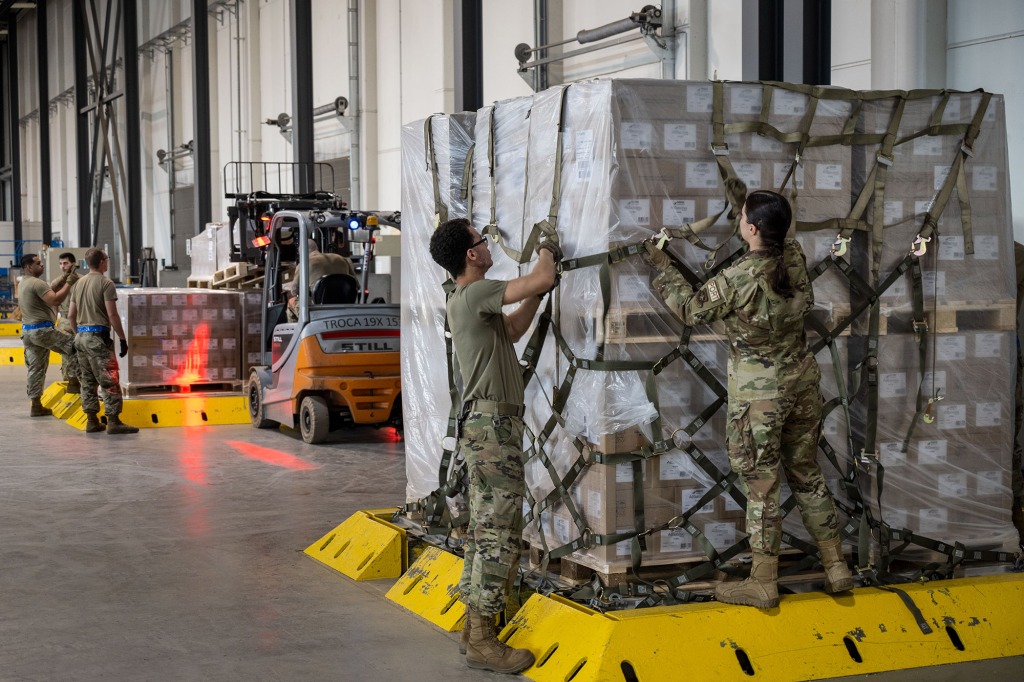airmen load pallets with baby formula which arrived by three trucks from Switzerland for the United States at Ramstein American Air Force base on May 21, 2022 in Ramstein-Miesenbach, Germany.