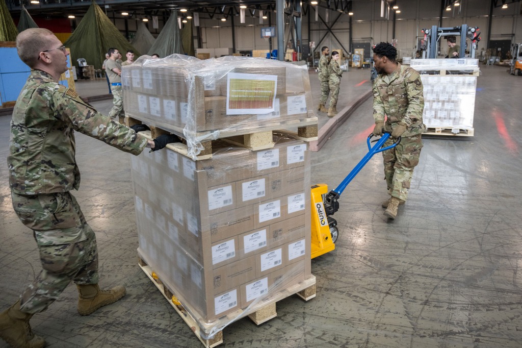 airmen load pallets with baby formula which arrived by three trucks from Switzerland for the United States at Ramstein American Air Force base on May 21, 2022 in Ramstein-Miesenbach, Germany