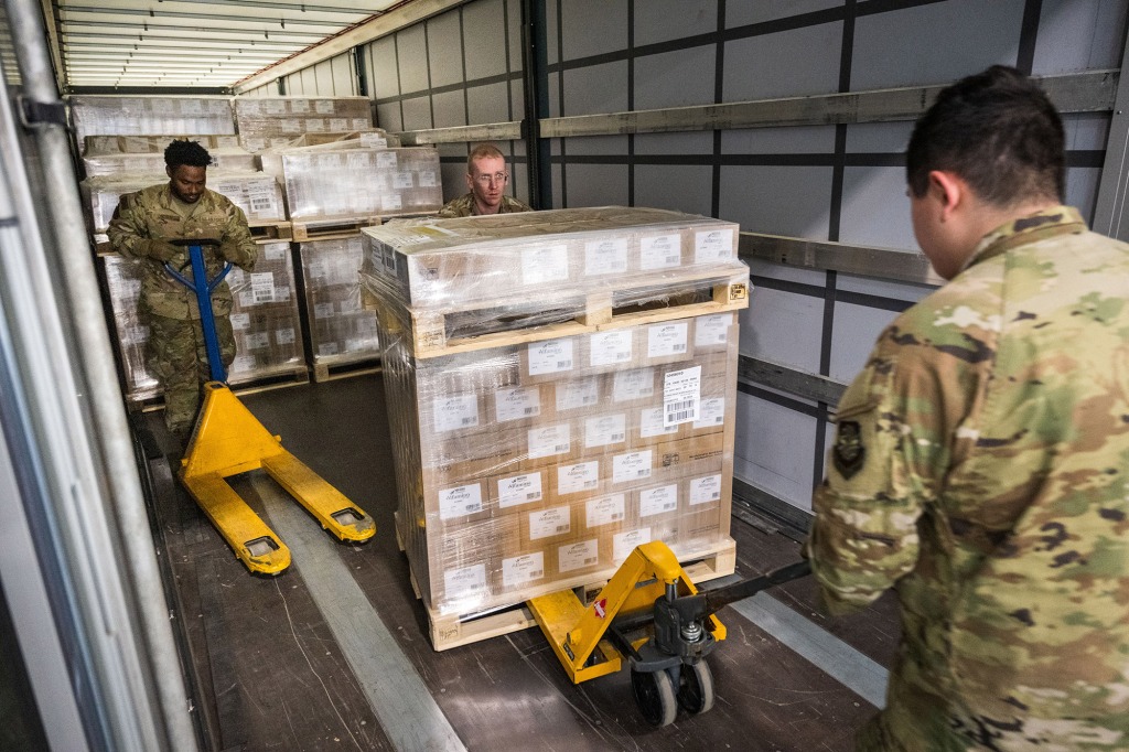 U.S. airmen load pallets with baby formula arrived with three trucks from Switzerland for the United States at Ramstein American Air Force base on May 21, 2022 in Ramstein-Miesenbach, Germany.