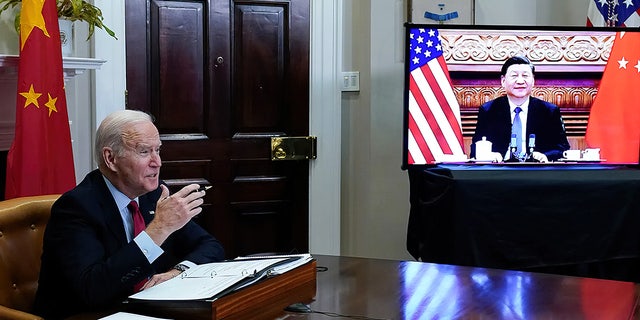  President Joe Biden meets virtually with Chinese President Xi Jinping from the Roosevelt Room of the White House in Washington, on Nov. 15, 2021.  