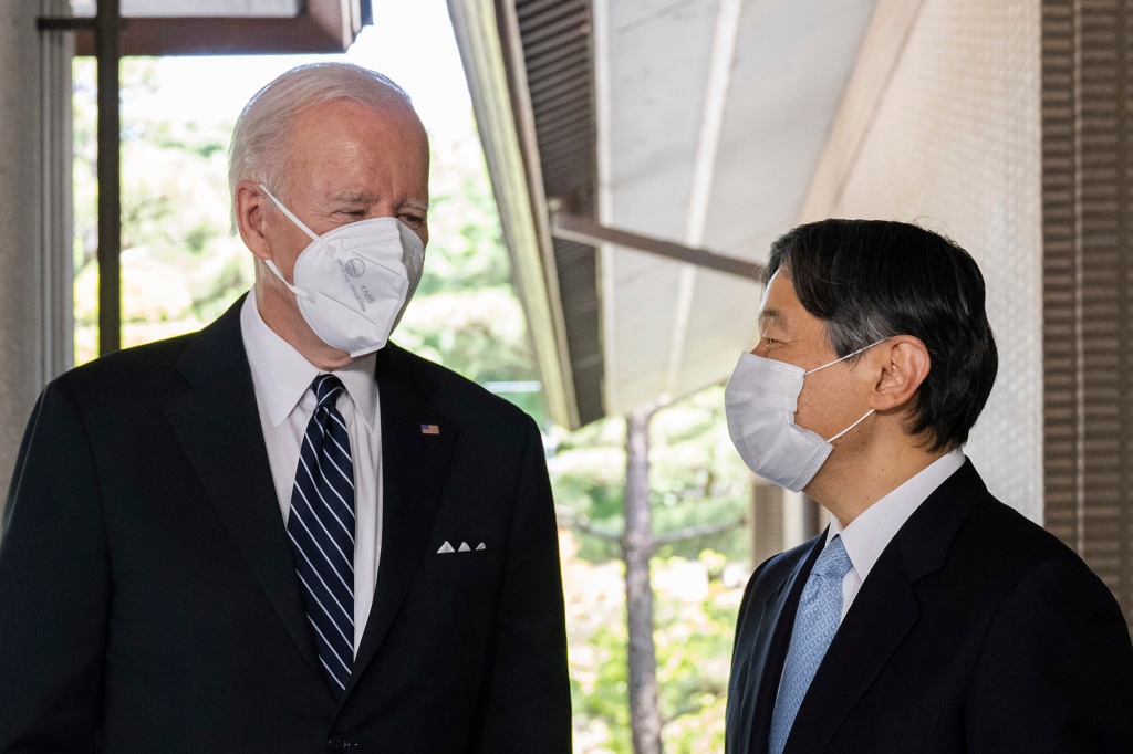 Japan's Emperor Naruhito, right, greets U.S. President Joe Biden prior to their meeting at the Imperial Palace in Tokyo Monday, May 23, 2022. 