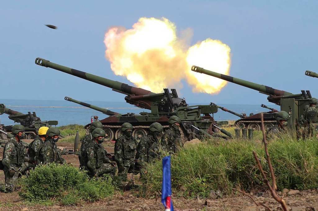 Taiwanese artillery guns fire live rounds during anti-landing drills as part of the Han Guang exercises held along the Pingtung coast in Taiwan.