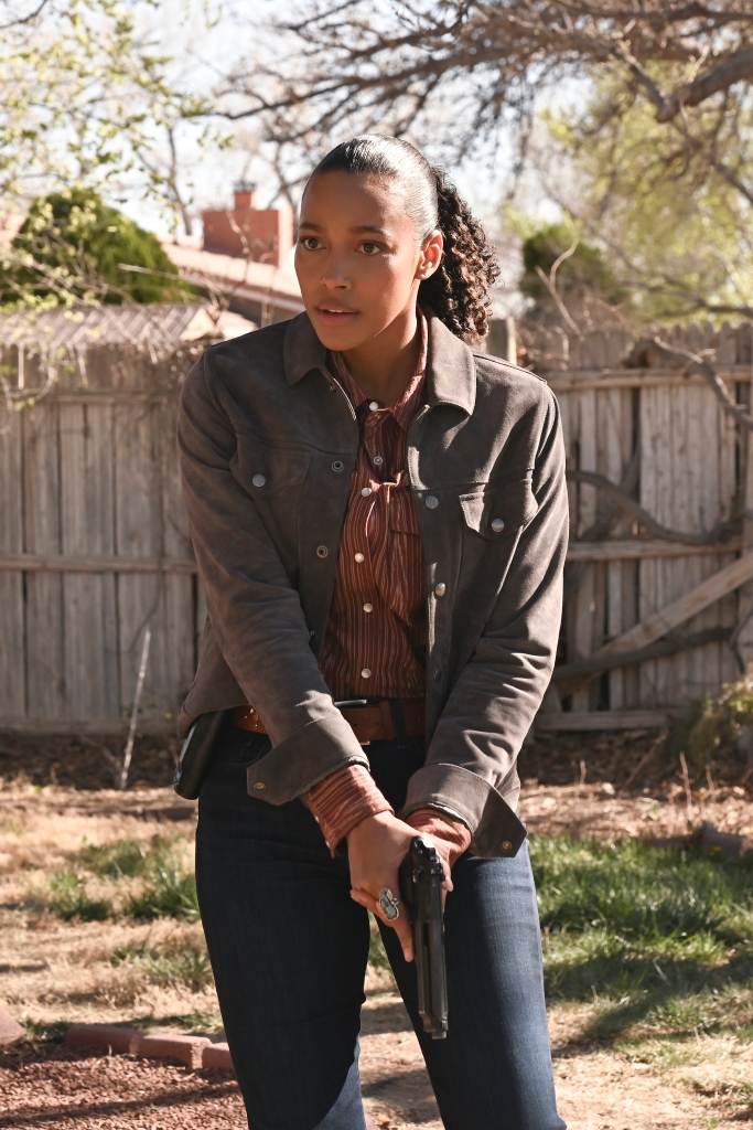 Cassie (Kylie Bunbury) is on the case in Thursday night's season finale of "Big Sky" on ABC. She's standing outside in a backyard, holding a gun with both hands (it's pointed downward).