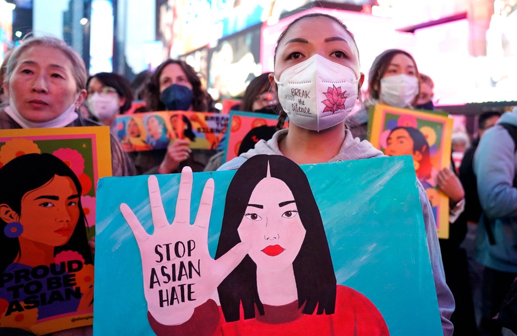 People protest hate crimes against Asian-Americans in Times Square on March 16, 2022.