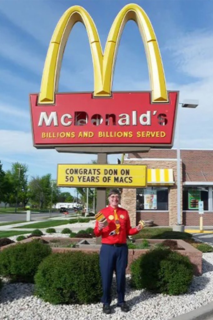 Gorske in front of his local McDonald's, which hangs his portrait in the restaurant.