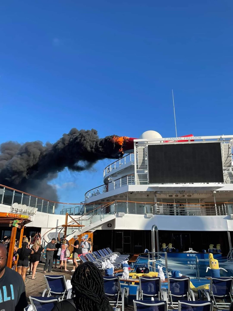 Photos and videos on Twitter show smoke and flames billowing from a cruise ship docked in Grand Turk on Thursday.
