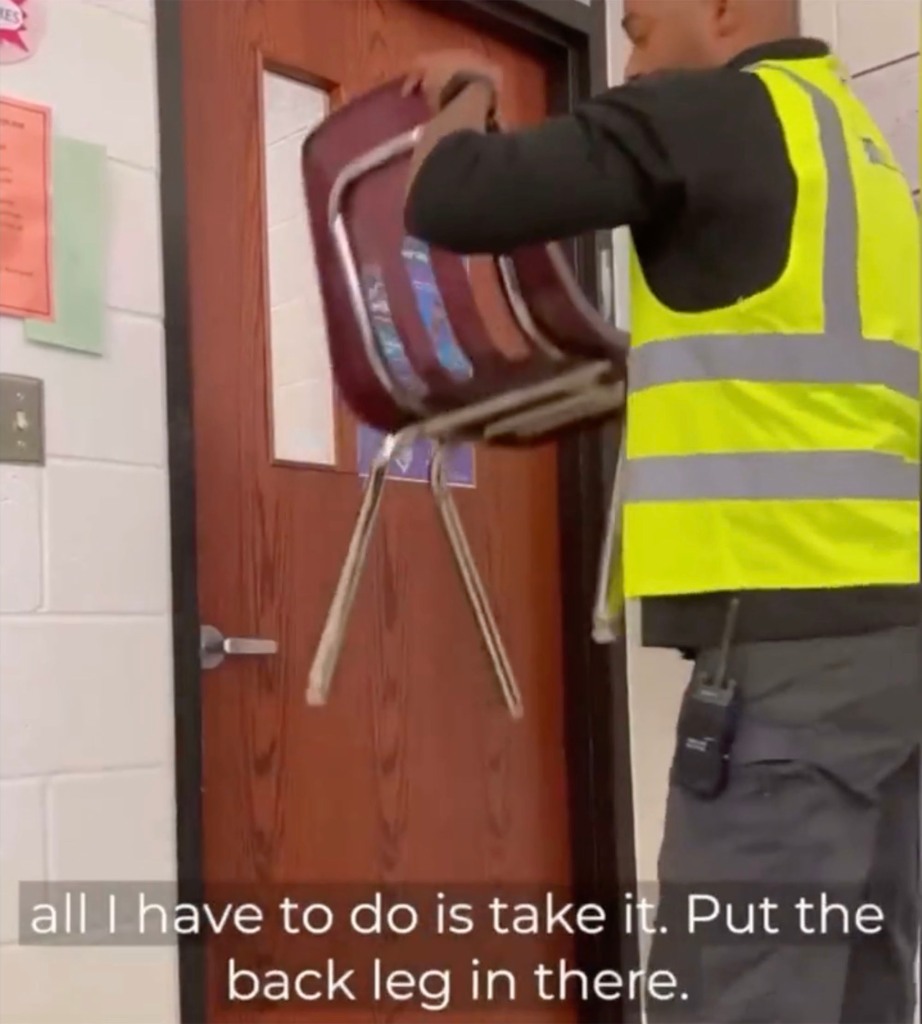 The instructor removes the chair, then demonstrates the door-blocking technique again, assuring his audience that the door could not be opened from the outside.