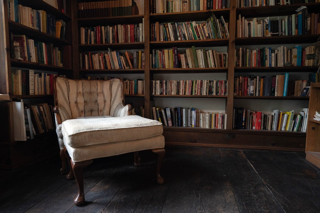 A library with a reading nook -- to stay distracted, of course.