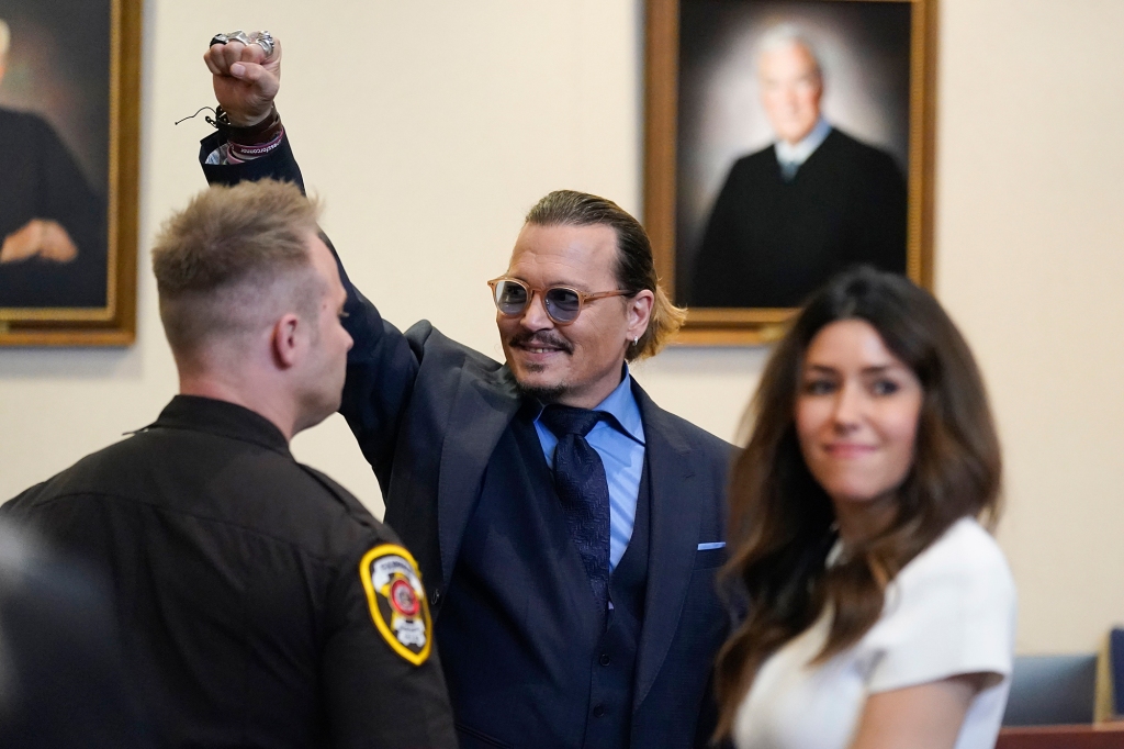 Actor Johnny Depp gestures to spectators in court after closing arguments on May 27.