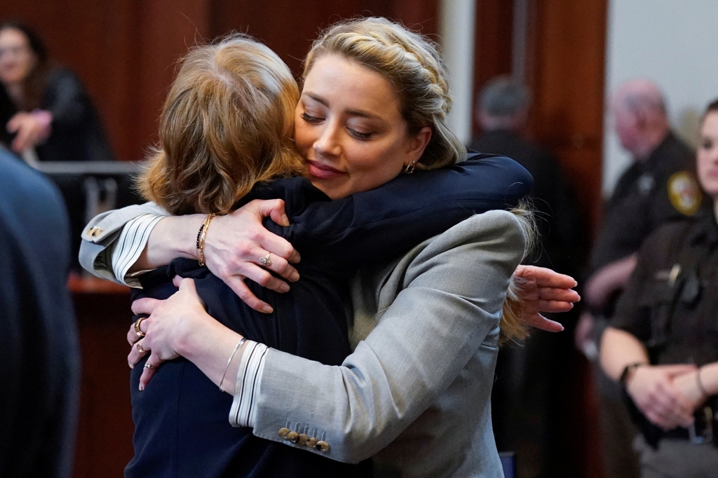 Actor Amber Heard hugs her attorney Elaine Bredehoft after closing arguments on May 27.