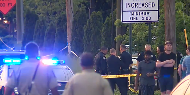 Law enforcement outside the scene of a shooting at the Fogo de Chao restaurant in Atlanta. 