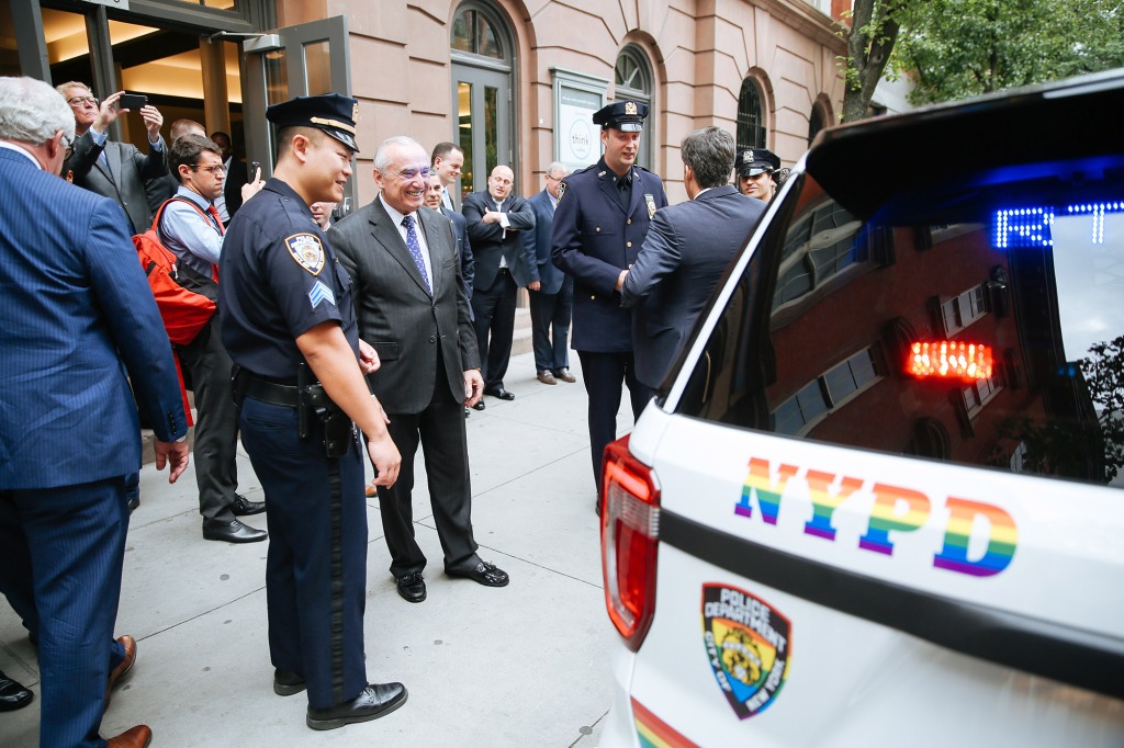 NYPD commissioner Bratton inspects a NYPD vehicle painted for the Pride Parade.