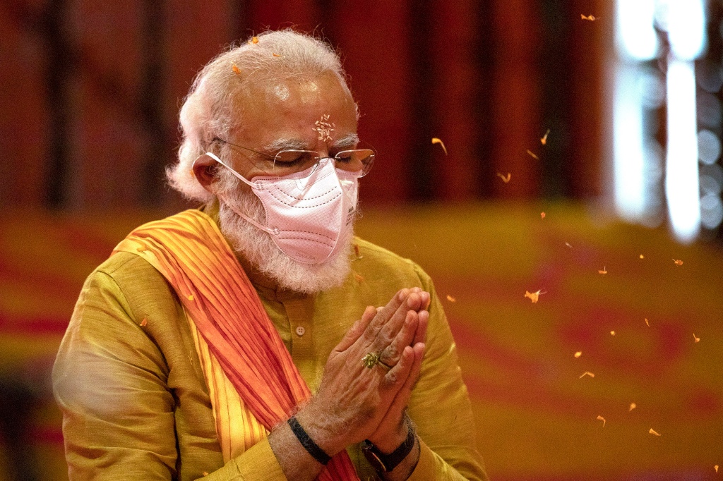 Indian Prime Minister Narendra Modi performs rituals during the groundbreaking ceremony of a temple dedicated to the Hindu god Ram, at the site of a demolished 16th century mosque, in Ayodhya, India on Aug. 5, 2020. Hindus believe the site of the mosque was the exact birthplace of their god Ram. Its demolition in 1992 sparked massive communal violence across India that left more than 2,000 people dead, mostly Muslims, and catapulted Prime Minister Narendra Modi's Bharatiya Janata Party to national prominence.