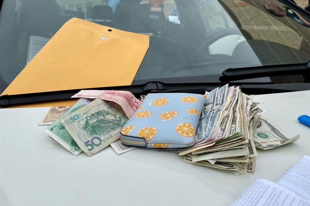 Cash on hood of car.