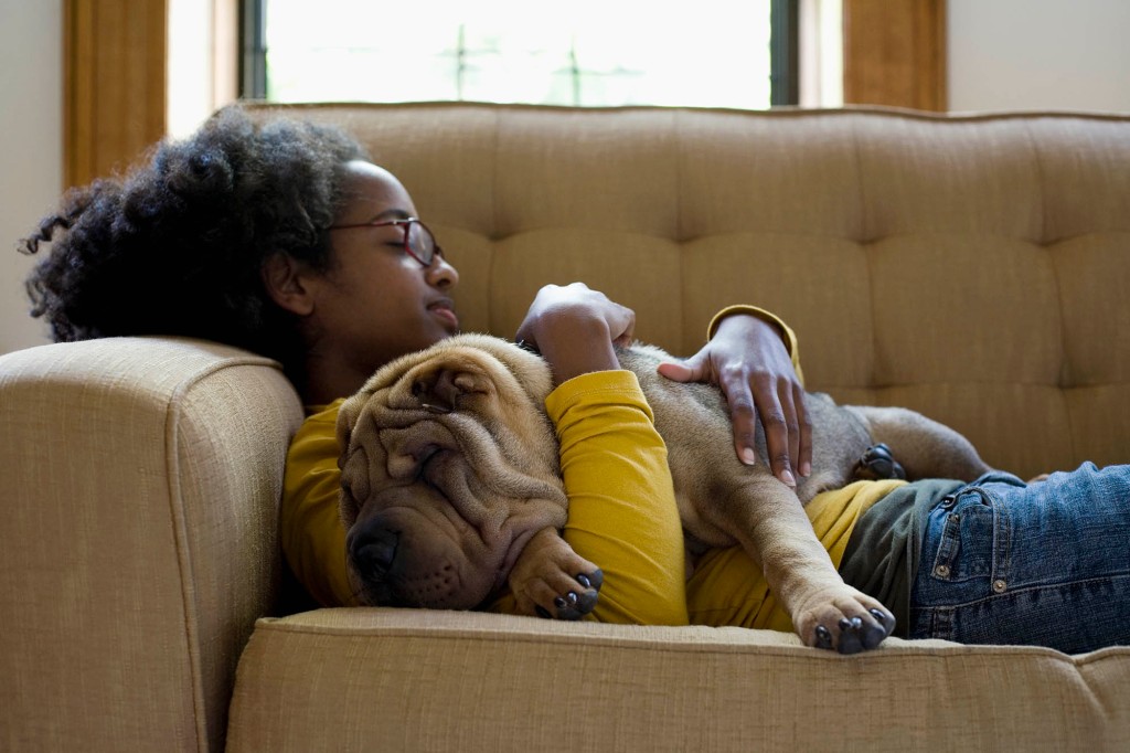 Woman on couch with dog