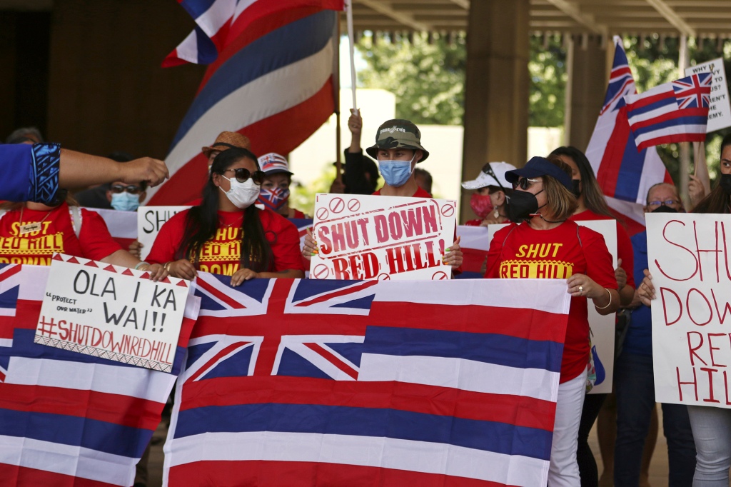 A group of demonstrators gather at the Hawaii state capitol for a rally over water contamination by the U.S. Navy near Pearl Harbor on Feb. 11, 2022, in Honolulu. 