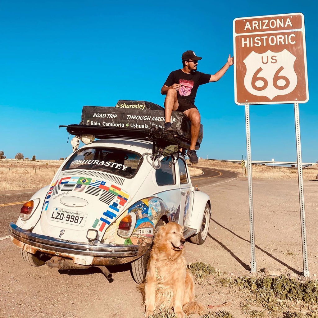 Jesse Koz posing with his Golden Retriever, Shurastey, on Route 66