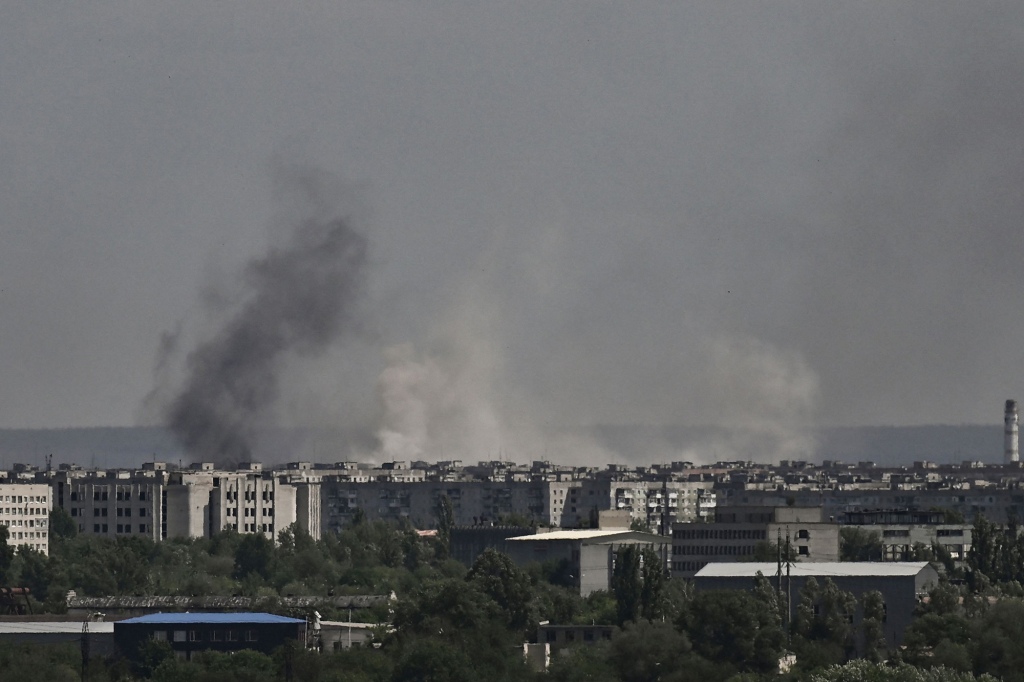 Smoke and dirt rise from the city of Severodonetsk