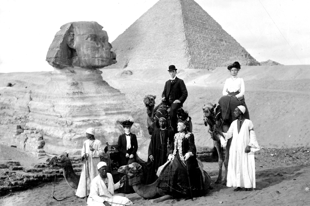 In Egypt, 1904, Jane Stanford (seated center), Elizabeth Richmond, her maid (at left), with her secretary, Bertha Berner, and her butler, Albert Beverly, on camels. 