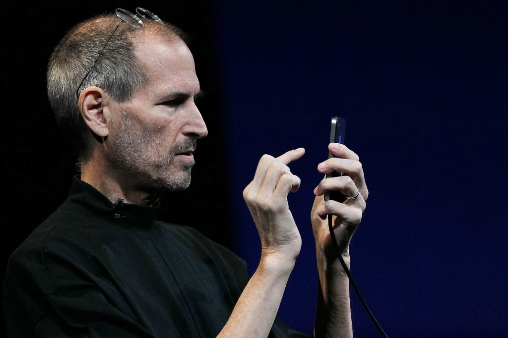 Jobs demonstrates the new iPhone 4 in 2010. The phone's initial success pushed Apple designers to develop products with equal aesthetic and commercial appeal.