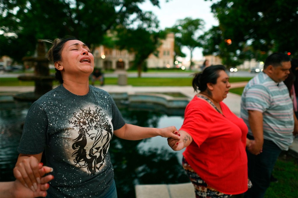 Kladys Castellón prays during a vigil for the victims of a mass shooting at Robb Elementary School in Uvalde, Texas.