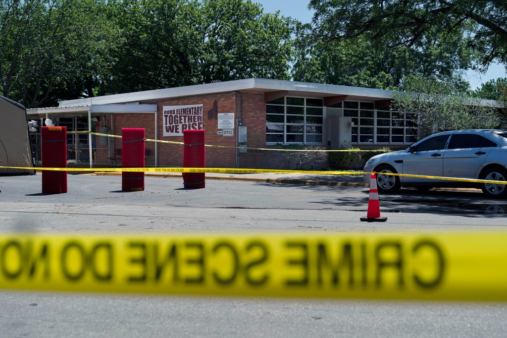 rime scene tape surrounds Robb Elementary School after a gunman killed 19 children and two teachers on May 24, 2022. 