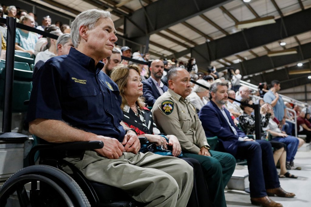 Texas Governor Greg Abbott, Uvalde County Sheriff Ruben Nolasco, ] and U.S. Senator Ted Cruz attend a vigil a day after a gunman killed 19 children and two teachers at Robb Elementary School, at Uvalde County Fairplex Arena, in Uvalde, Texas.