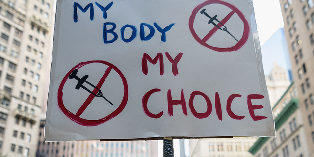 Protestors opposed to Covid-19 vaccine mandates and vaccine passports by the government rally at City Hall in New York City on August 25, 2021.