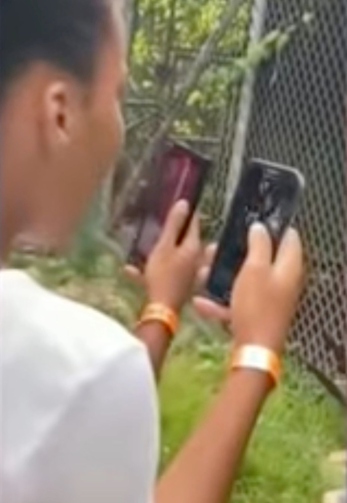 Bystanders record the botched stunt on their iPhones.