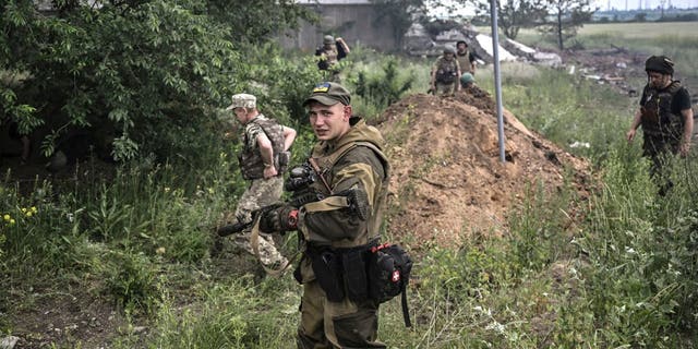 A Ukrainian serviceman after a strike on a warehouse on the outskirts of Lysychansk in the eastern Ukrainian region of Donbas June 17, 2022.