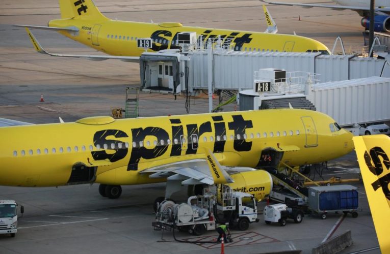 Spirit plane towed after brakes overheat, ignite