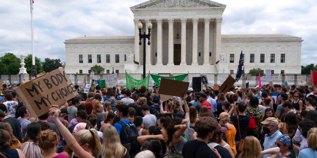 Protesters gather outside the Supreme Court in Washington, Friday, June 24, 2022.