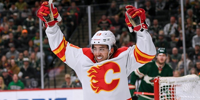 FILE - Calgary Flames left wing Johnny Gaudreau celebrates his goal on Minnesota Wild goalie Cam Talbot during the second period of an NHL hockey game Thursday, April 28, 2022, in St. Paul, Minn.