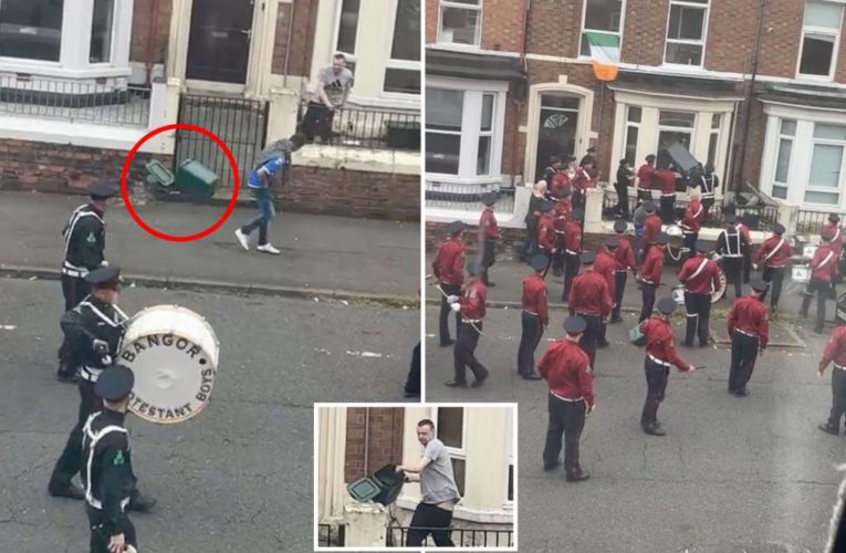 Man hurls garbage can at passing parade band in wild video: ‘Legendary’