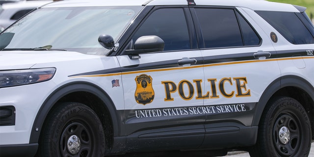 A U.S. Secret Service Uniformed Division police car is parked in front of the White House in Washington, April 21, 2022. 