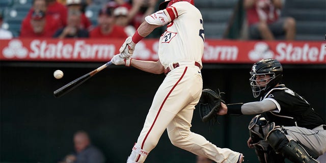 Los Angeles Angels' Mike Trout hits an RBI double against the Chicago White Sox during the first inning of a baseball game Wednesday, June 29, 2022, in Anaheim, Calif.